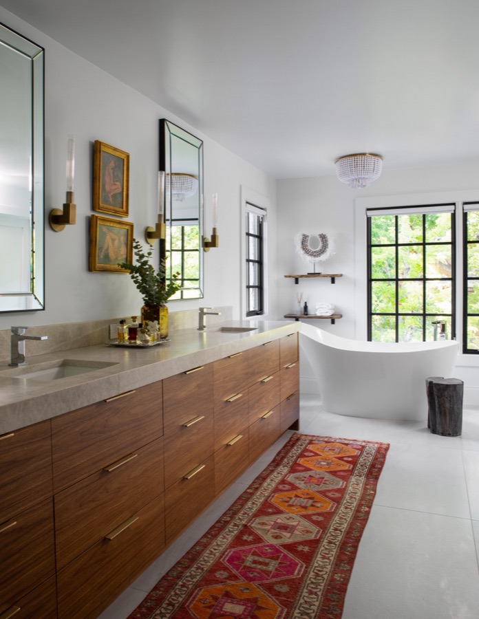 Primary bathroom with floating walnut double vanity and vintage runner — Greenwood Village hidden-detail whole home renovation