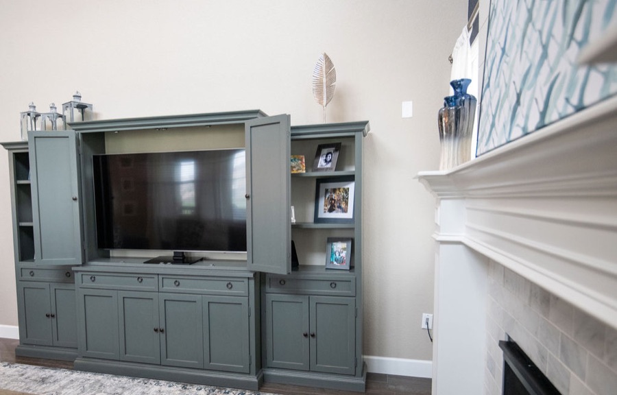 Full-height shiplap fireplace drawing the eye upward — Blackstone family room renovation in Aurora, Colorado