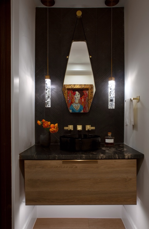 Dramatic bar niche with black walls, floating walnut shelf, and sculptural pendant — Greenwood Village hidden-detail whole home renovation