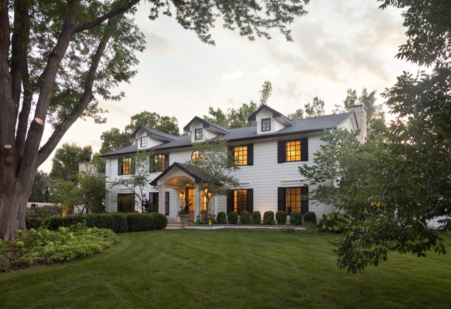 Rear exterior at dusk with warm interior light — Greenwood Village hidden-detail whole home renovation