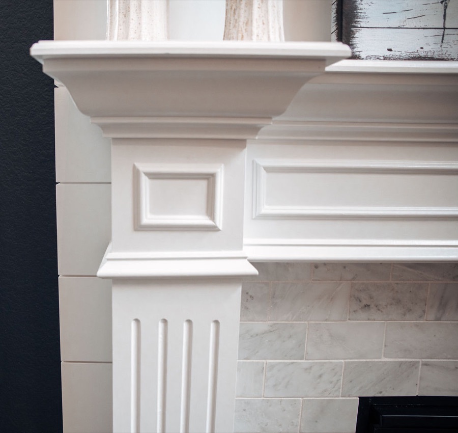 Fireplace and sectional from the kitchen sightline — Blackstone family room renovation in Aurora, Colorado