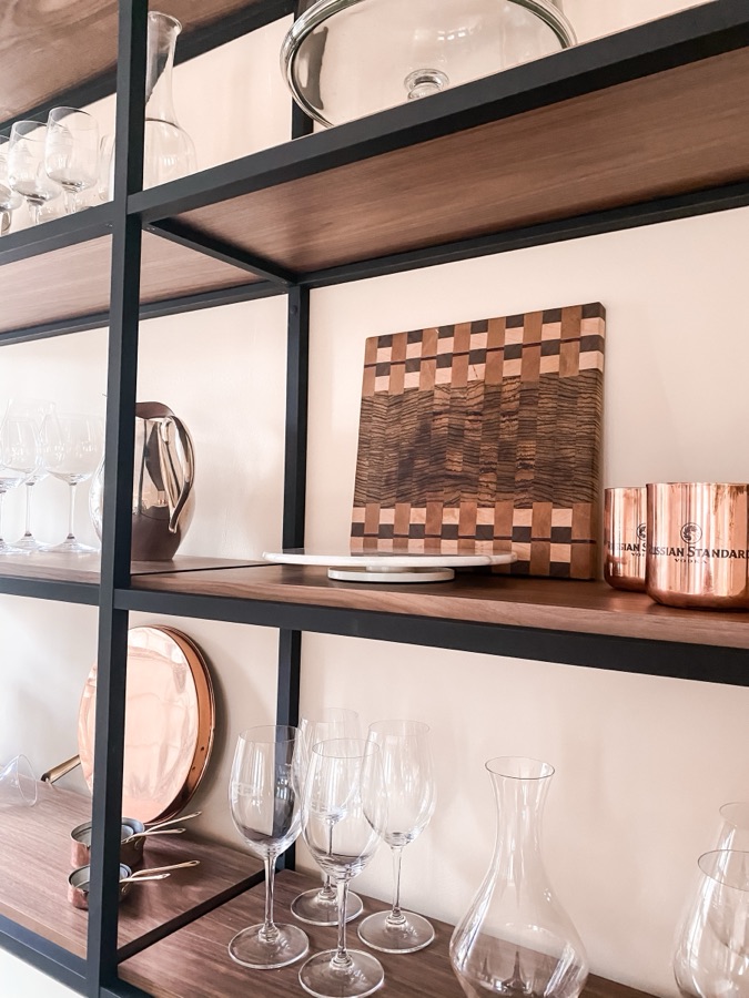 Open shelving styled with cutting boards and copper — historic Colorado Springs kitchen remodel
