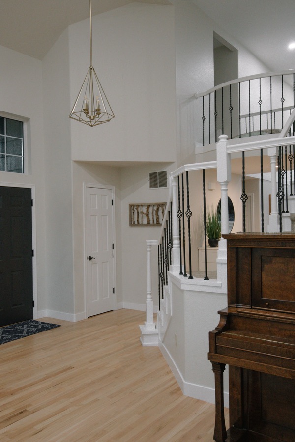 Living room with view to the home office through French doors — Stonegate main floor renovation in Parker, Colorado