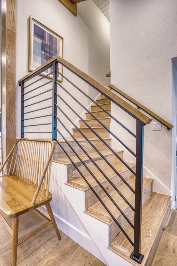 Stair detail with modern spindle rail — Fulton Street whole house renovation in Greenwood Village