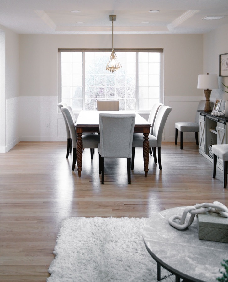 Formal dining room with white table and soft flokati rug — Stonegate main floor renovation in Parker, Colorado