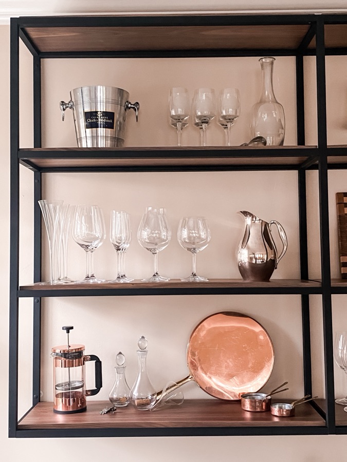 Metal shelf unit with copper cookware and barware — historic Colorado Springs kitchen remodel