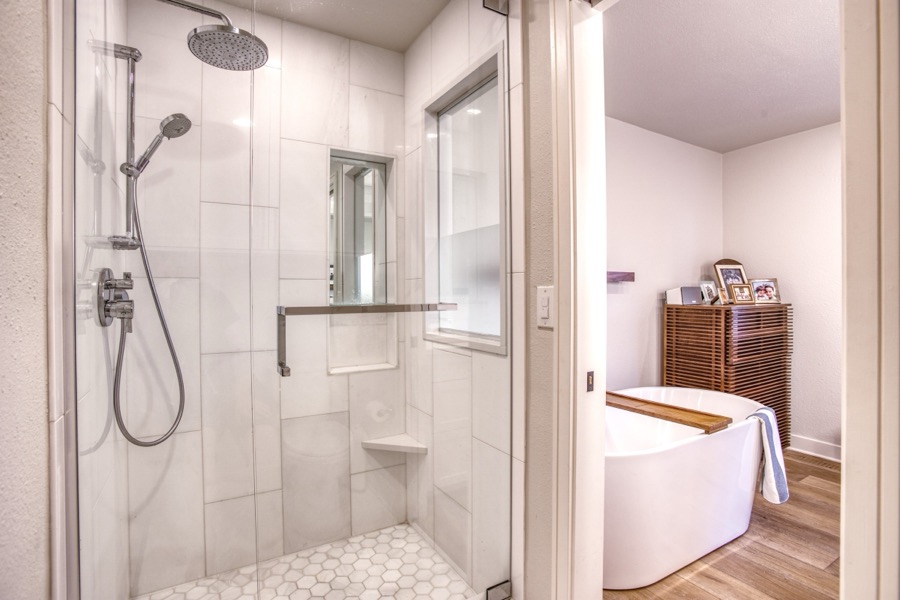 Primary bath with freestanding tub and white oak vanity — Fulton Street whole house renovation in Greenwood Village