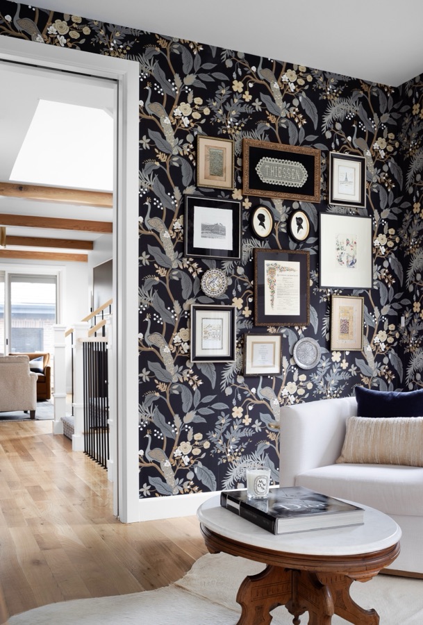 Sitting room with dark floral wallpaper and gallery wall of family art — Bonnie Brae whole home renovation in Denver