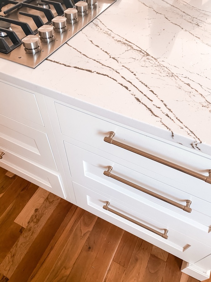 Waterfall counter edge and brass hardware detail — historic Colorado Springs kitchen remodel