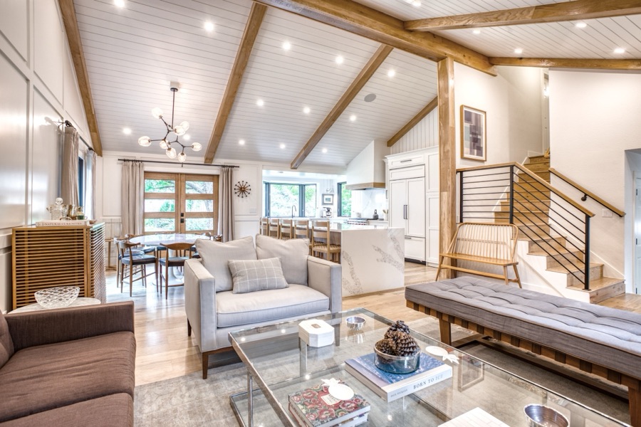 Family room with white paneling and comfortable mixed seating — Fulton Street whole house renovation in Greenwood Village