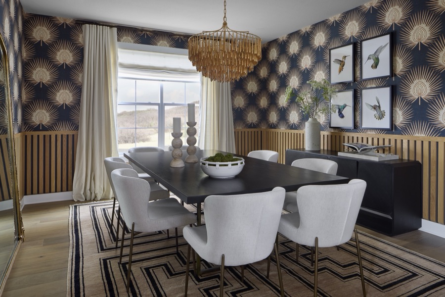Entry with teal paneled wall, round mirror, and rust velvet stools in The Canyons at Castle Pines