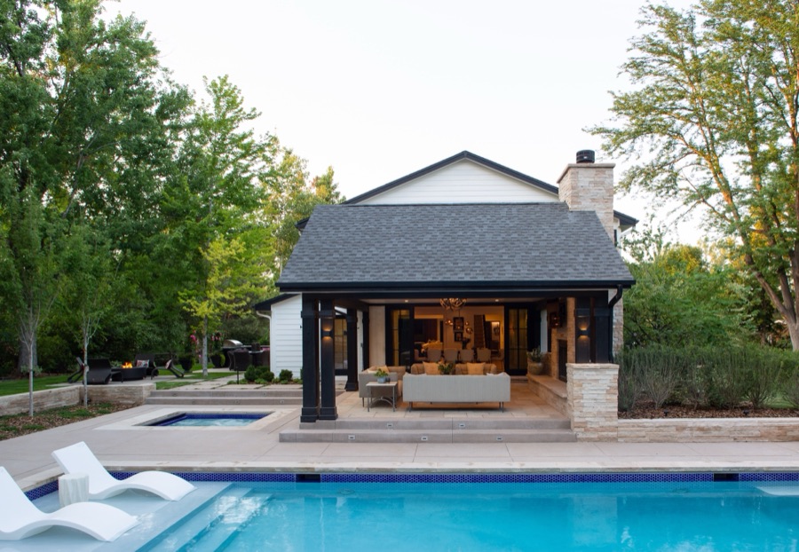 Backyard pool and pool house with black-and-white patterned accent wall — Greenwood Village hidden-detail whole home renovation