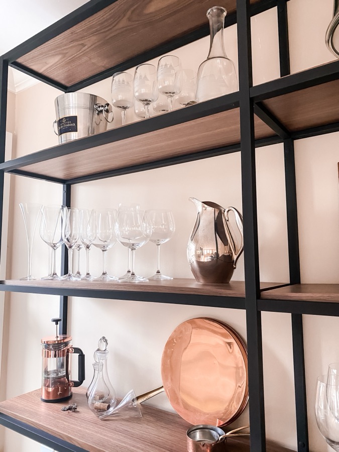 Shelf detail with wine glasses and serveware — historic Colorado Springs kitchen remodel
