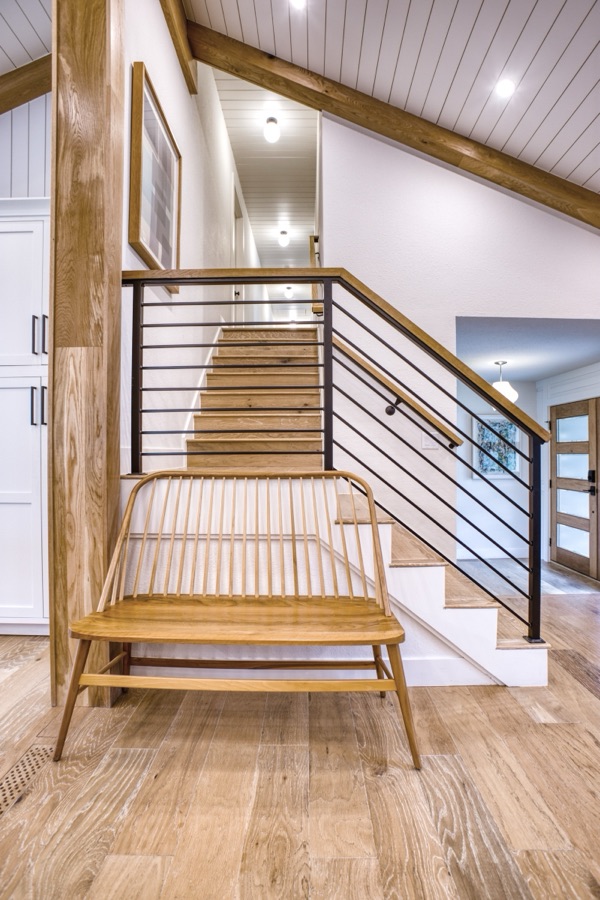Sunken lounge with glass rail and white oak stairs — Fulton Street whole house renovation in Greenwood Village