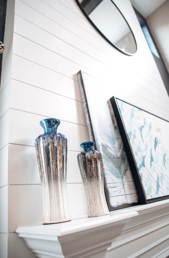 Entertainment center detail beside the cast-stone fireplace — Blackstone family room renovation in Aurora, Colorado
